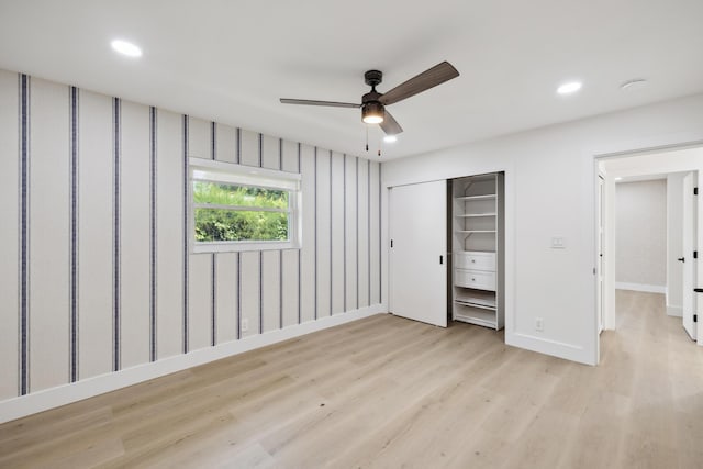unfurnished bedroom featuring recessed lighting, a closet, light wood finished floors, baseboards, and ceiling fan