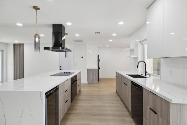 kitchen with black appliances, modern cabinets, a sink, wine cooler, and island range hood