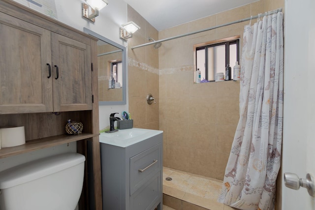 full bath with toilet, a shower stall, and vanity