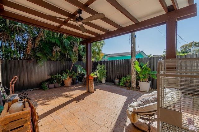 view of patio featuring a fenced backyard and ceiling fan