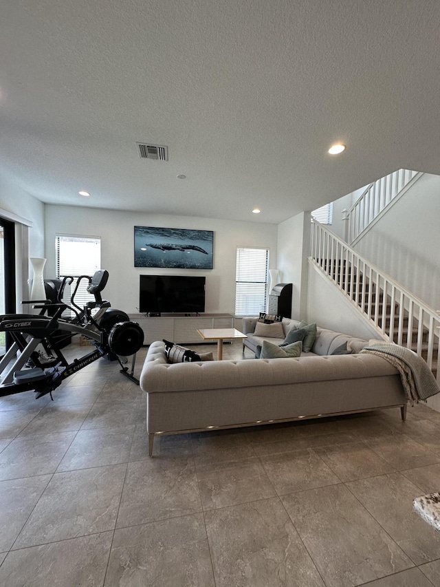 living room with a textured ceiling