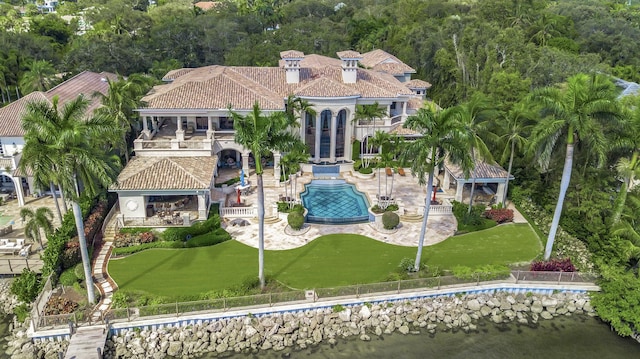 birds eye view of property with a water view