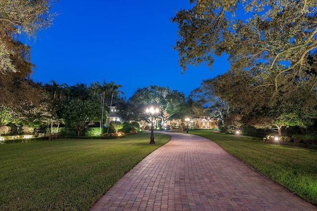 surrounding community featuring a yard