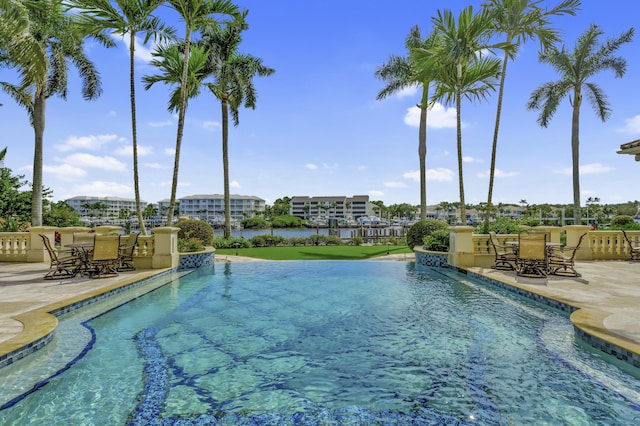 view of swimming pool with a patio area