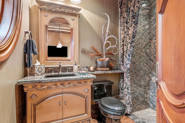 bathroom with vanity and toilet