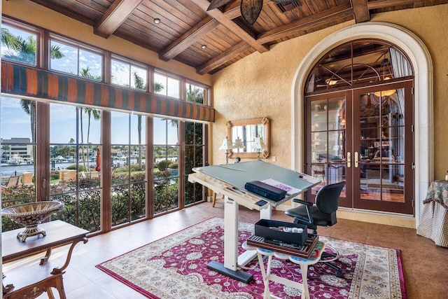 tiled office space with french doors, beamed ceiling, wood ceiling, and plenty of natural light