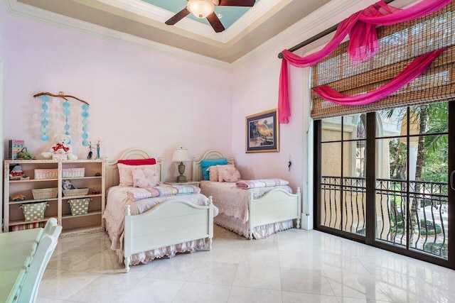 bedroom with a tray ceiling, access to exterior, ceiling fan, and ornamental molding