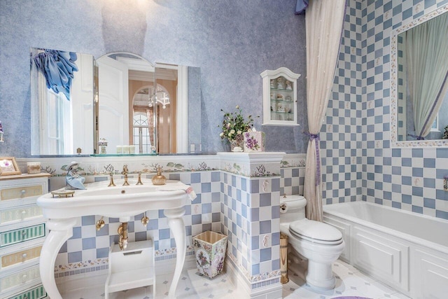 bathroom with a bathtub and toilet