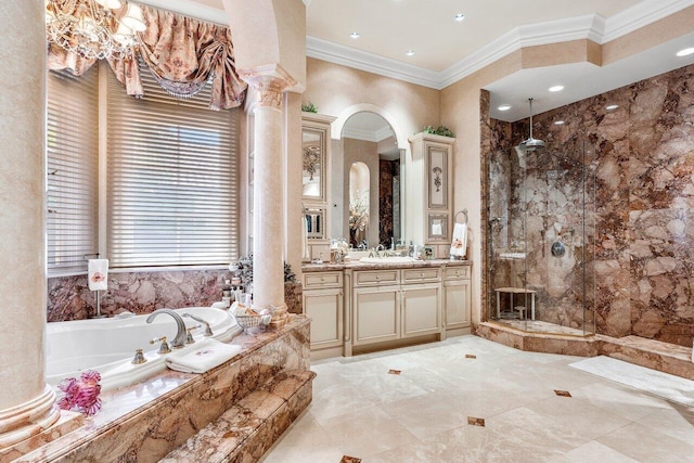 bathroom with vanity, ornamental molding, plus walk in shower, and decorative columns