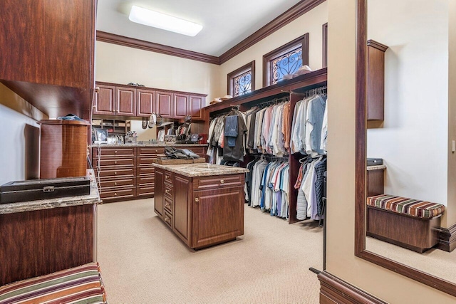 spacious closet featuring light colored carpet