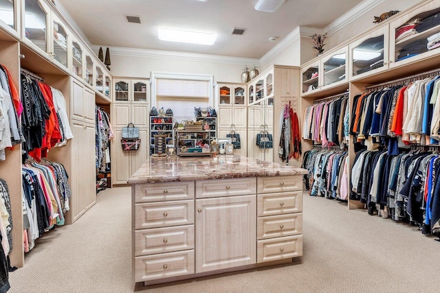 spacious closet featuring light carpet