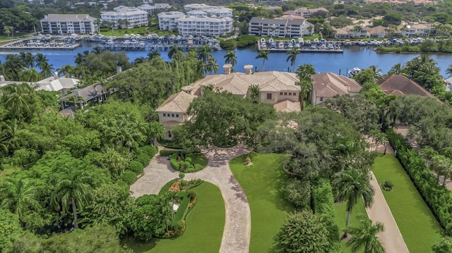 birds eye view of property with a water view