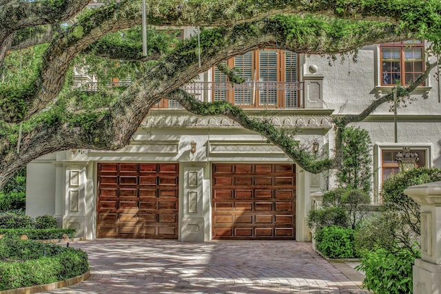 view of front of house with a balcony and a garage