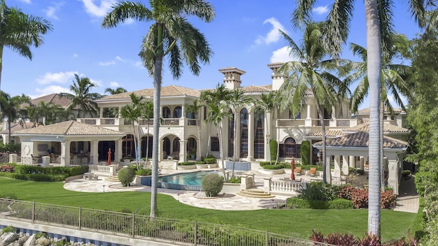 view of pool featuring a yard and a patio