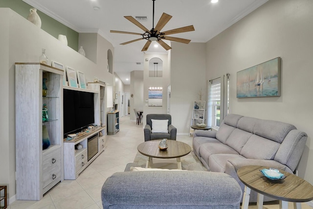 12044 Serafino St, Boynton Beach, FL 33437 - living room with a high ceiling, a ceiling fan, light tile patterned floors, crown molding, and baseboards
