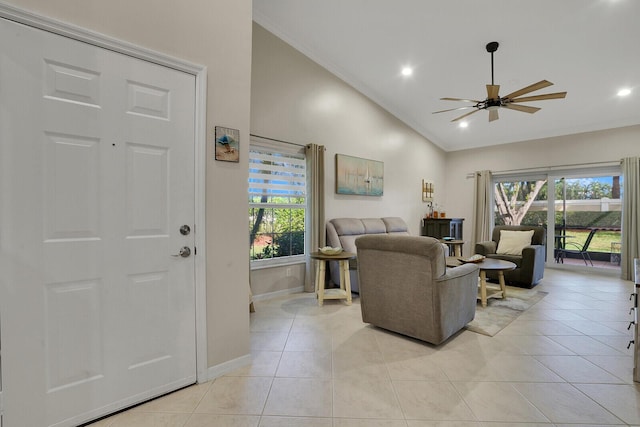 living room with recessed lighting, a ceiling fan, light tile patterned flooring, high vaulted ceiling, and baseboards