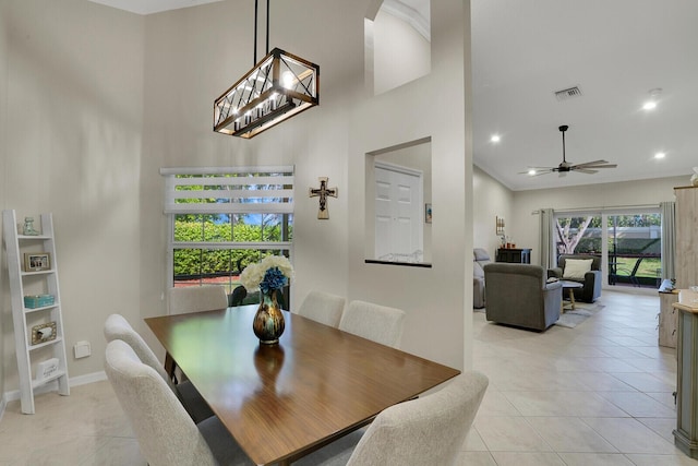 12044 Serafino St, Boynton Beach, FL 33437 - dining area with a towering ceiling, light tile patterned floors, baseboards, ceiling fan, and recessed lighting