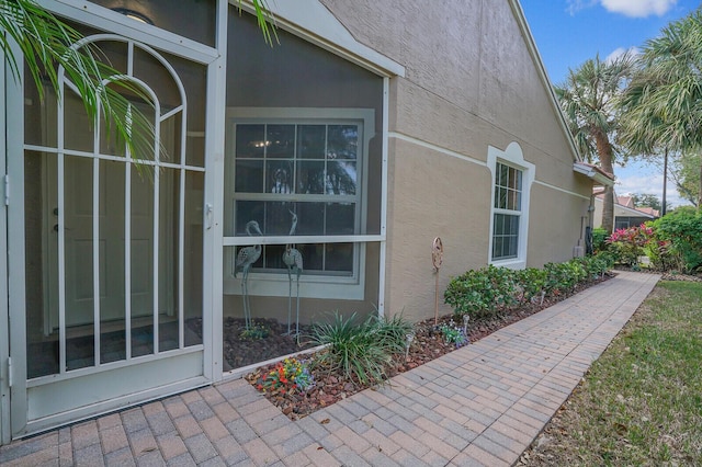 view of side of home featuring stucco siding