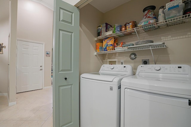 12044 Serafino St, Boynton Beach, FL 33437 - laundry area featuring independent washer and dryer, light tile patterned floors, and baseboards