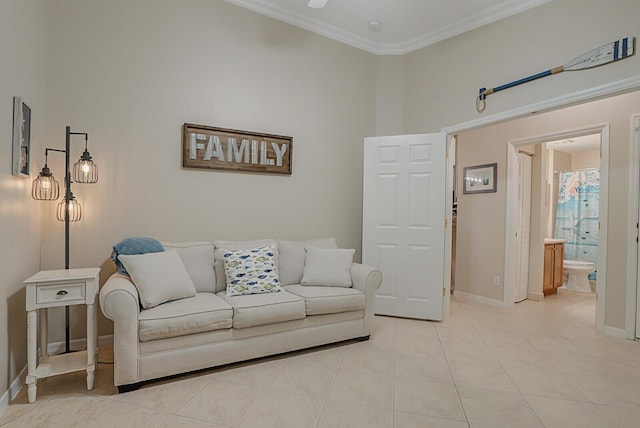 living room with light tile patterned floors, ornamental molding, a towering ceiling, and baseboards