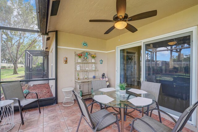 sunroom / solarium with ceiling fan