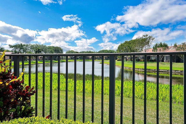 exterior space featuring a water view and a yard