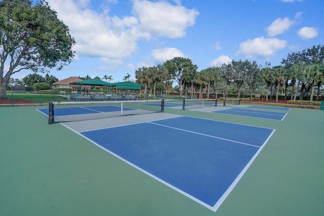 view of sport court featuring basketball hoop