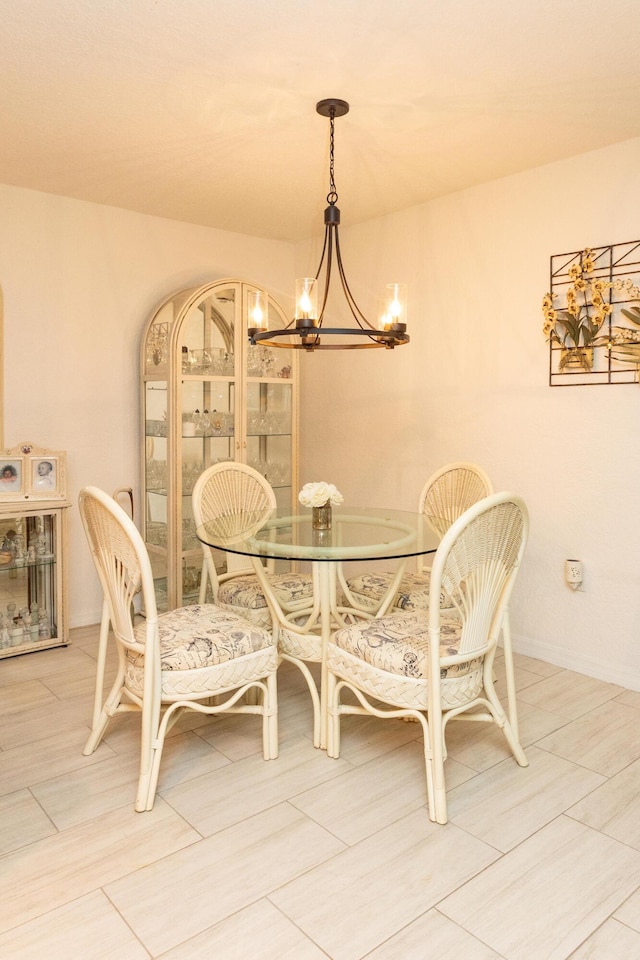 dining area with an inviting chandelier