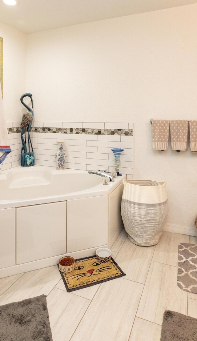 bathroom with a tub