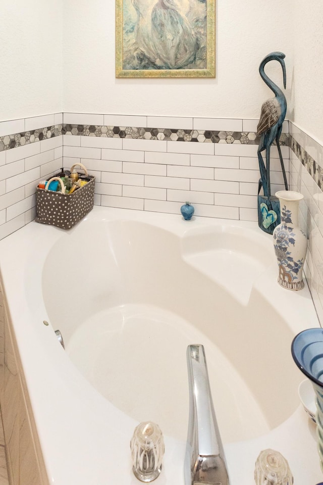 bathroom featuring tiled bath