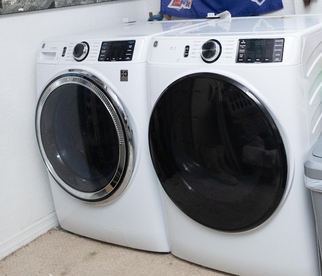 washroom with independent washer and dryer