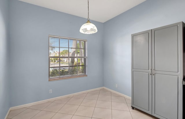 unfurnished dining area featuring light tile patterned floors