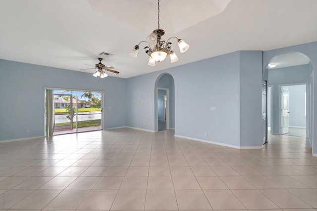 empty room with ceiling fan with notable chandelier and light tile patterned flooring