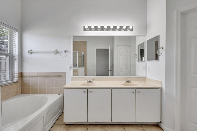 8620 Pine Cay, West Palm Beach, FL 33411 - bathroom with a bath, double vanity, tile patterned floors, and a shower stall