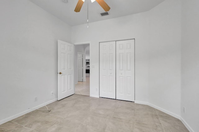 8620 Pine Cay, West Palm Beach, FL 33411 - unfurnished bedroom featuring a closet, a ceiling fan, and baseboards