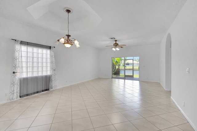 8620 Pine Cay, West Palm Beach, FL 33411 - unfurnished room with a chandelier, arched walkways, ceiling fan, light tile patterned floors, and radiator heating unit