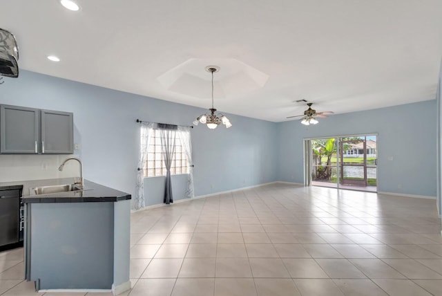 kitchen with dishwasher, sink, decorative light fixtures, gray cabinets, and ceiling fan with notable chandelier