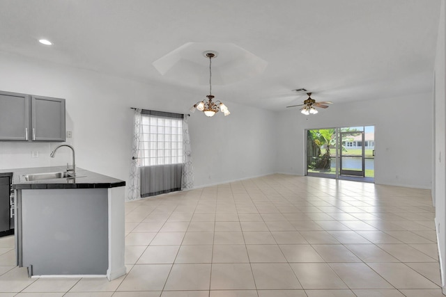 8620 Pine Cay, West Palm Beach, FL 33411 - kitchen featuring a sink, a chandelier, open floor plan, ceiling fan, and gray cabinetry