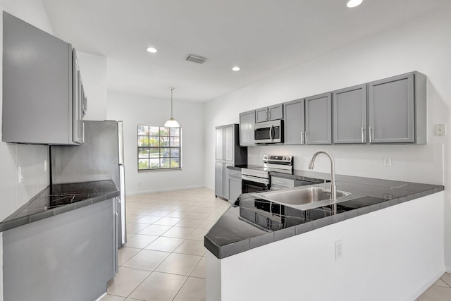 8620 Pine Cay, West Palm Beach, FL 33411 - kitchen with stainless steel appliances, a sink, baseboards, recessed lighting, and gray cabinetry