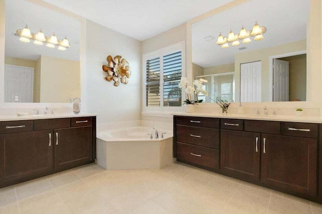 bathroom with tile patterned floors, vanity, and plus walk in shower