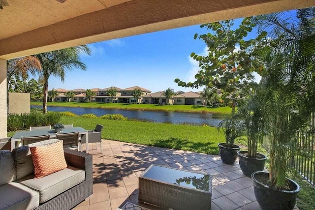 view of patio / terrace featuring a water view and an outdoor hangout area