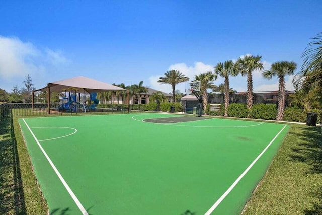 view of basketball court with a playground