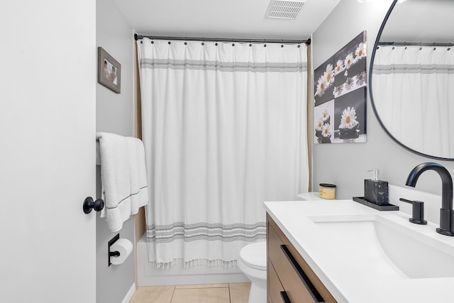 full bathroom featuring vanity, toilet, tile patterned floors, and shower / bath combo with shower curtain