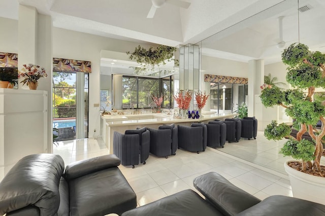 tiled living room with ceiling fan