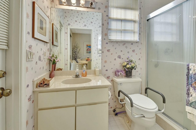 bathroom with tile patterned floors, vanity, toilet, and a shower with door