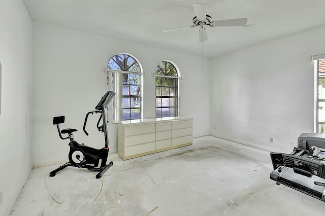 workout room featuring ceiling fan