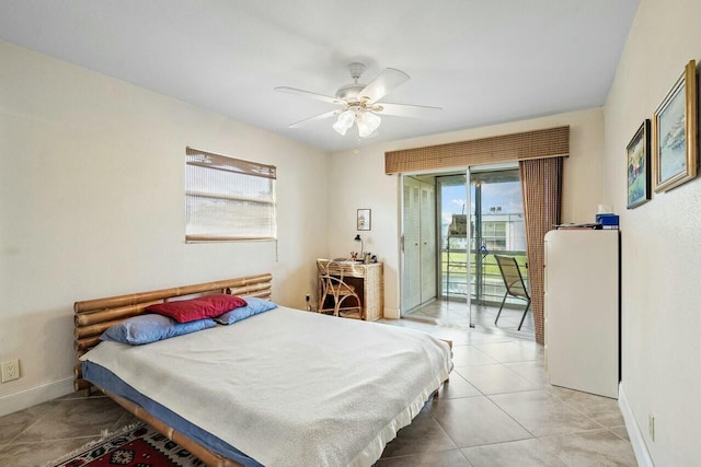 bedroom featuring access to outside, tile patterned floors, and ceiling fan