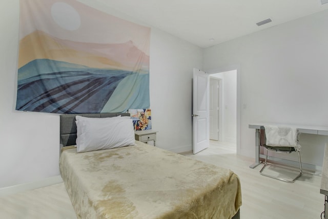 bedroom featuring light hardwood / wood-style floors