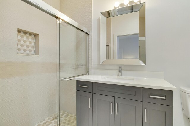 full bathroom featuring vanity, shower / bath combination with curtain, and toilet