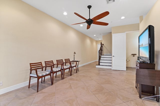 sitting room with ceiling fan and light tile patterned floors